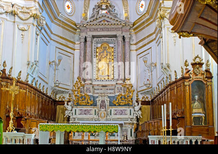 The classical interior of Santa Maria Assunta Cathedral with the Black Madonna icon over the altar, Positano Stock Photo