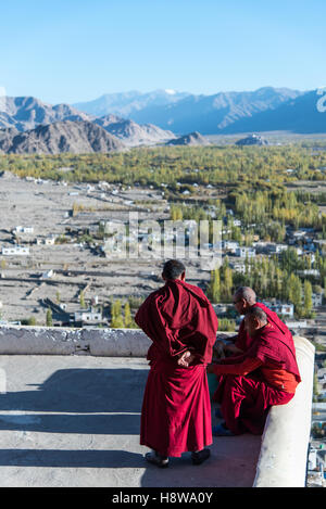 Monks sitting on top floor with beautiful Nature view. Stock Photo