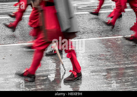 Men march in Lord Mayor's show in London, England November 2016.  Red stockings buckle shoes royalty royal soldier Stock Photo