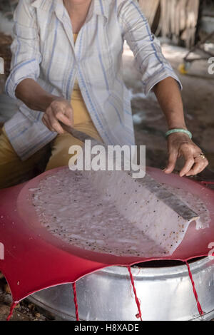 woman preparing rice noodles in Cai Be, Mekong Delta, Vietnam, Asia Stock Photo