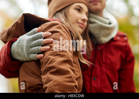 close up of happy couple hugging in autumn park Stock Photo