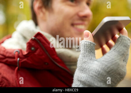 close up of man recording voice on smartphone Stock Photo