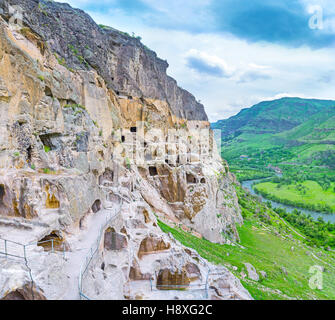 The view from the slope of Erusheti Mount, occupied by Vardzia monastic complex, consisting of carved caves and chambers, Samtskhe-Javakheti Region, G Stock Photo
