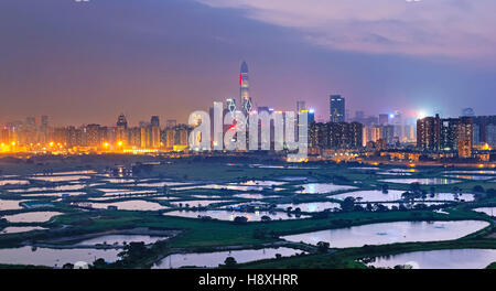 Shenzhen citscape at night , view from hiong kong countryside Stock Photo