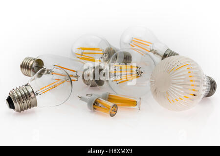 a performance different types of E27 and G4 LED bulbs with different number of LED filaments, focusing on the bulb in the foregr Stock Photo