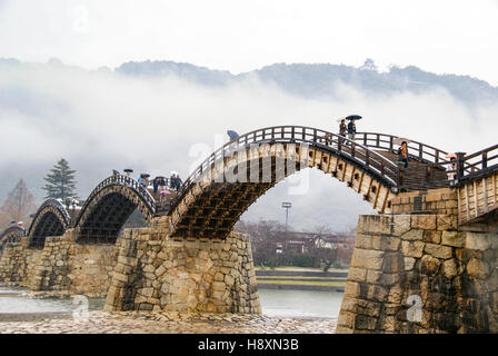 This beautiful traditional arched bridge in Japan is the Kintai Bridge, or Kintaikyo Stock Photo