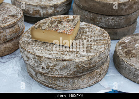 Artisan cheese for sale at a farmers market. Stock Photo