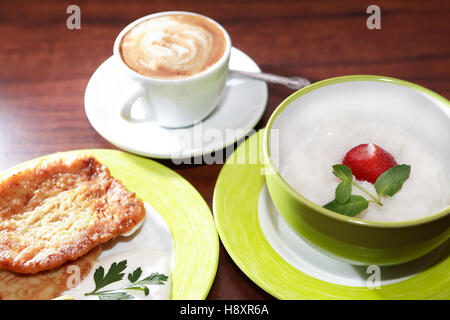 Set of breakfast food on table. Pancakes. Coffee. Rice porridge Stock Photo