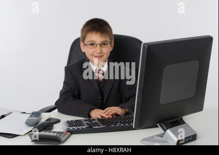 Little businessman in office Stock Photo