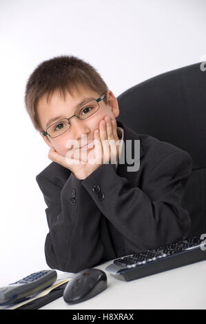 Little businessman in office Stock Photo