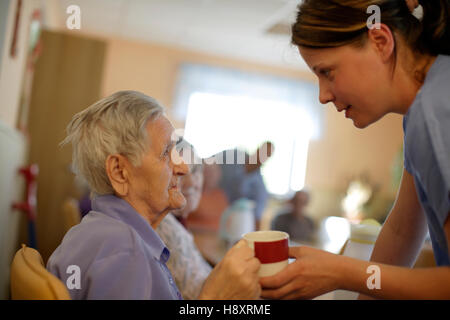 Nursing home, elderly woman with a nurse Stock Photo