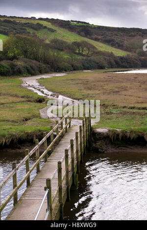 A wooden footbridge over the River gannel in Newquay, Cornwall. Stock Photo