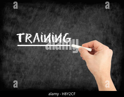 Training - hand writing text on chalkboard Stock Photo
