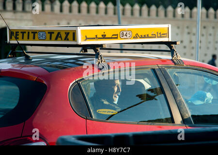 Red petit taxi of Fès, Morocco. The small red taxis are particularly cheap in Fez Stock Photo