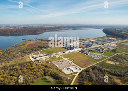 Aerial view of John Deere's Dubuque, Iowa manufacturing facility along the Mississippi River, with Wisconsin in the background, Stock Photo