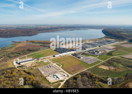 Aerial view of John Deere's Dubuque, Iowa manufacturing facility along the Mississippi River, with Wisconsin in the background, Stock Photo