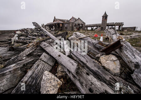 Piles of rotten wood are heaped on Birnbeck Pier, near Weston-super-Mare, Somerset, which opened on June 5th 1867 and is now derelict and dilapidated. Stock Photo