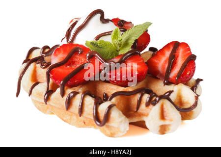 Belgian waffles with strawberries and chocolate topping close up isolated on white background Stock Photo