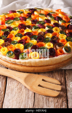 Healthy eating: summer vegetable tart close-up on the table. vertical Stock Photo