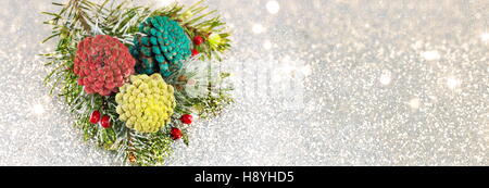 Pinecones and fir tree on sparkling background. Christmas decoration background Stock Photo