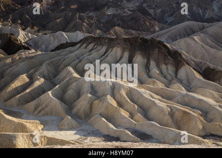 Eroding volcanic ash and silt hills, badlands, at Zabriskie Point, Death Valley National Park, California. Superb example of dry Stock Photo