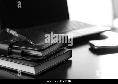 office desk with a computer and a telephone diary Stock Photo