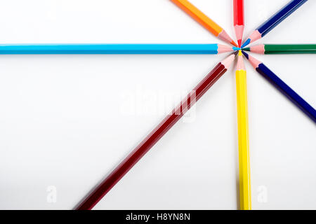 Colored pencils arranged in a star shape in natural light Stock Photo