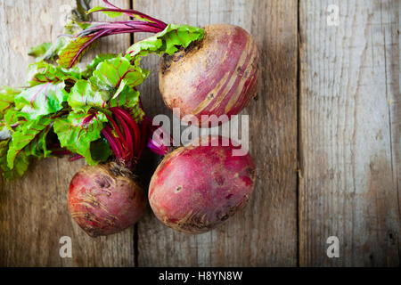 Fresh organic beets on a wood table. Stock Photo