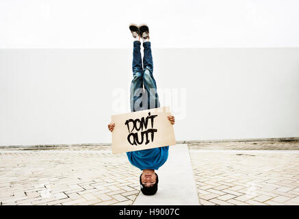 Man Holding Speech Sign Don't Quit Cocncept Stock Photo