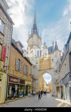 AUXERRE, FRANCE - OCTOBER 12, 2016: Scene of the clock tower, and Rue de lHorloge, with locals and visitors, in Auxerre, Burgundy, France Stock Photo