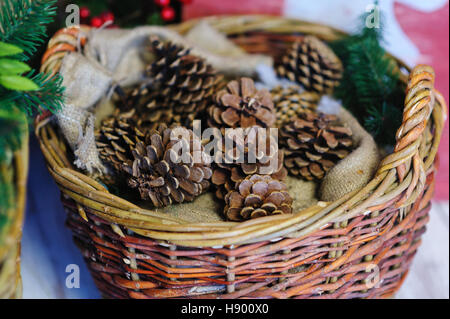 pine cones in a basket. Christmas Decor Stock Photo