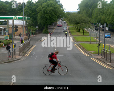 bicycle cyclist crossing A82 great western road Stock Photo