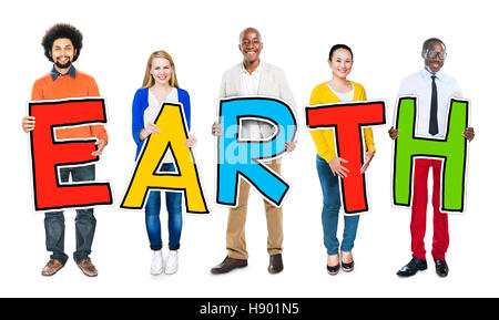 Multi-Ethnic Group of People Holding Text Earth Stock Photo