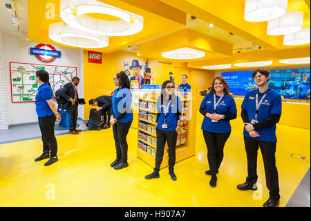 London, UK  17 November 2016.  Staff greet their first customers.  The world's largest Lego store is opened by Sadiq Khan, Mayor of London, in Leicester Square.  Huge crowds gathered for the opening and many Lego fans were able to buy exclusive pieces.  Credit:  Stephen Chung / Alamy Live News Stock Photo