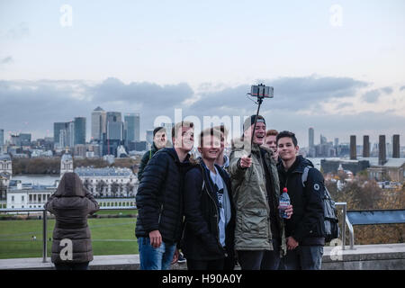 London, UK. 17th November 2016. Visitors enjoy late afternoon sunshine in Greenwich Park, South East London,whilst parts of the south coast were battered by strong winds and tornados were reported in Aberystwyth, Wales.  Credit:  claire doherty/Alamy Live News