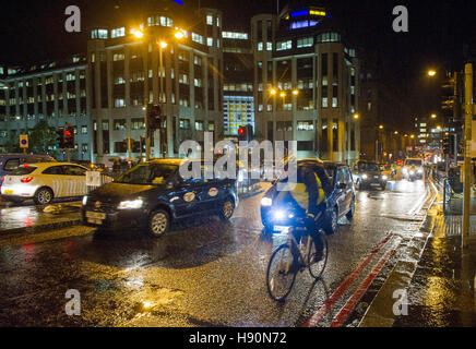 Lothian Road in Edinburgh's financial district on a wet night during rush hour.