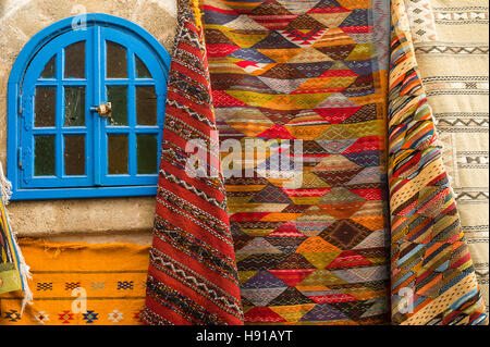 Rugs and carpets displayed outside a shop in the souk, Essaouira, Morocco Stock Photo
