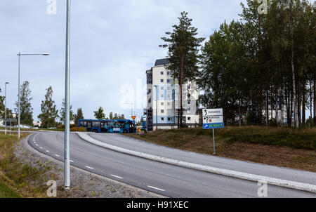 UMEA, SWEDEN ON AUGUST 30, 2016. View of a modern suburban settlement, street, traffic. Bus stop and sign this side. Editorial. Stock Photo