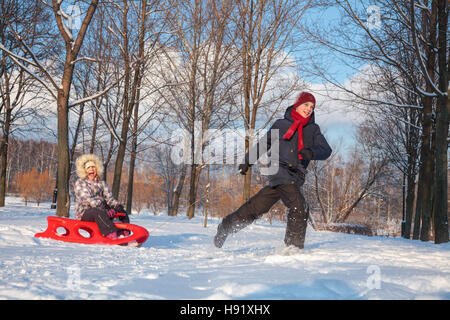 little-girl-pulls-boy-on-600w-
