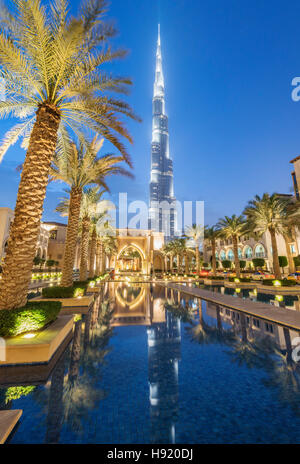 View of Burj Khalifa and Souq al Bahar at night in Downtown Dubai in United Arab Emirates