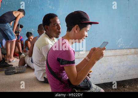 Havana, Cuba: Young gamers gathered on an afternoon off at the Ciudad Deportiva (Sport City) Stock Photo