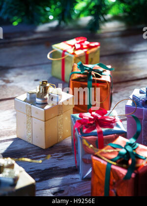 close up view of christmas  gift boxes  on wooden back Stock Photo