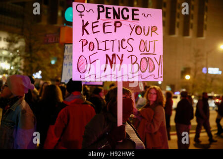 Indianapolis, Indiana, USA. 12th Nov, 2016. Anti-Trump protesters hold signs and march against United States president elect Donald Trump, and his running mate vice president elect Mike Pence. The protesters who ranged from muslims, Black Lives Matter activists, members of the LGBTQ community, women, immigrants and others, are angry about the policies proposed by Trump, and that he was not elected by the popular vote, but will be elected by the electoral college. Seven protesters were arrested during the march, and at one point police used rubber bullets and pepper balls against members of the Stock Photo