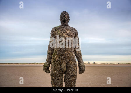 Anthony Gormley's art installation 'Another Place' at Crosby beach in Liverpool. Stock Photo
