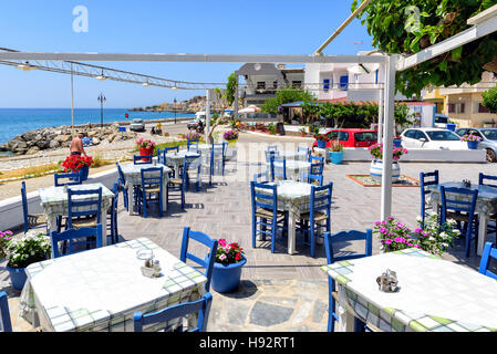 Traditional Greek tavern in traditional blue  colors near the beach of Paleochora town on Crete island, Greece Stock Photo