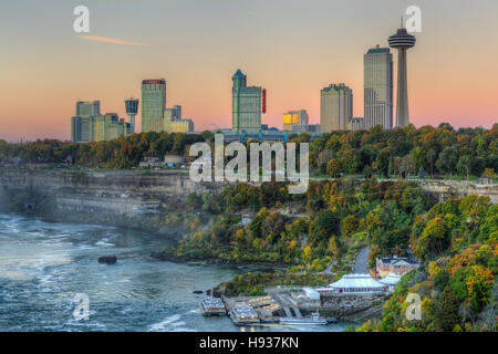 A view of the Niagara River and skyline of Niagara Falls, Ontario just before sunrise. Stock Photo