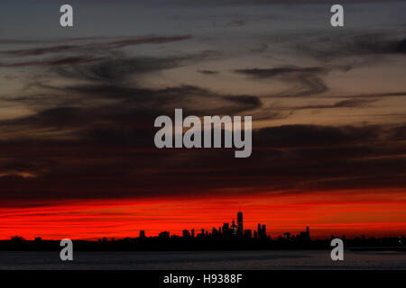 Lower Manhattan, New York City skyline as seen from the Rockaways looking across Jamaica Bay at sunset.