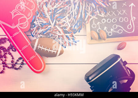 Game day football party table. Watching game on VR goggles. Stock Photo