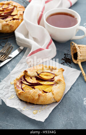 Open pie with plums Stock Photo