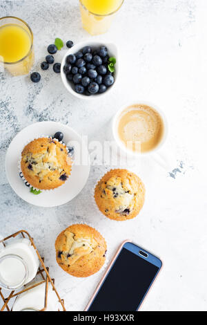 Bright and airy breakfast with blueberry muffin Stock Photo